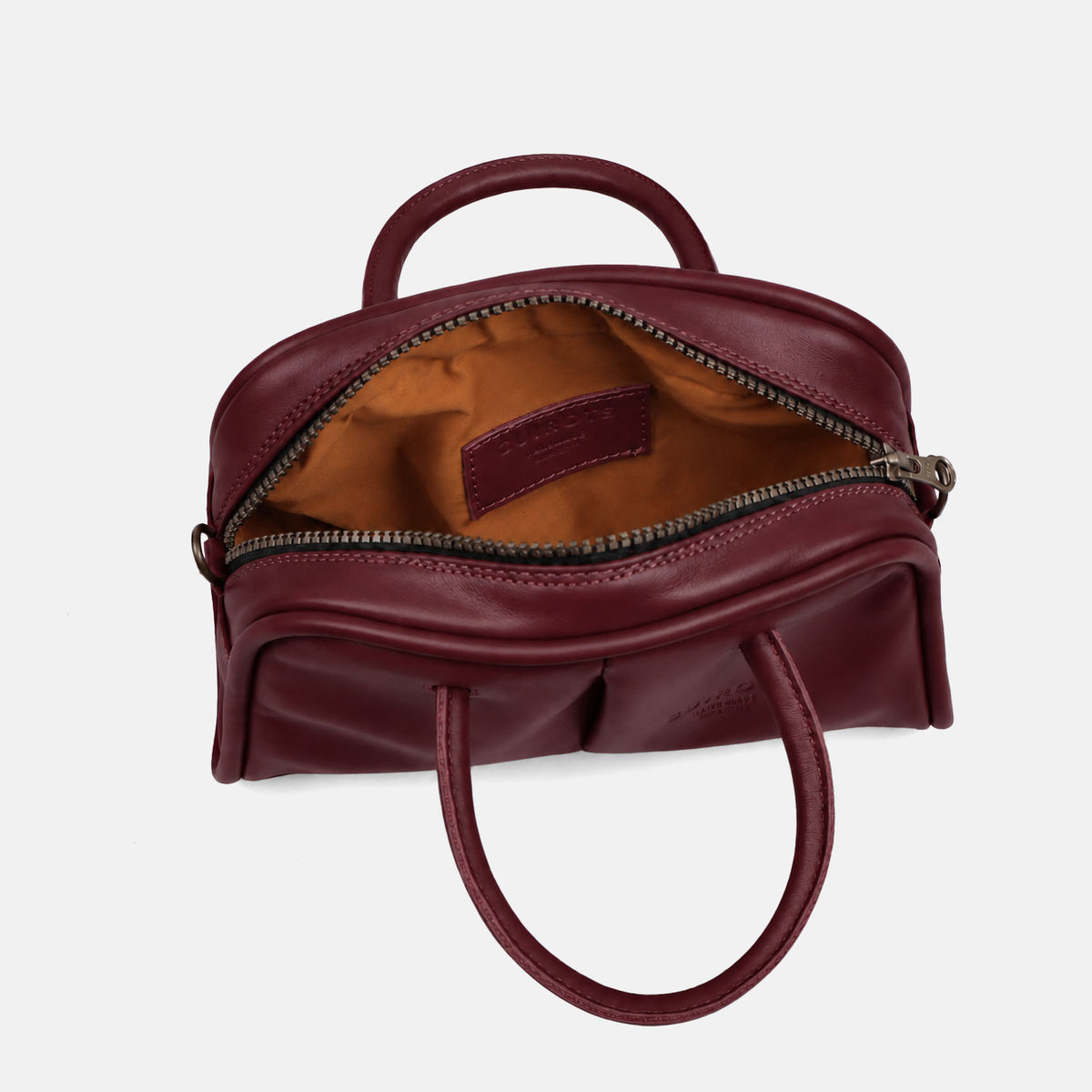 Bolso de mano y bandolera pequeño Classic en color burdeos, abierto, con forro interior