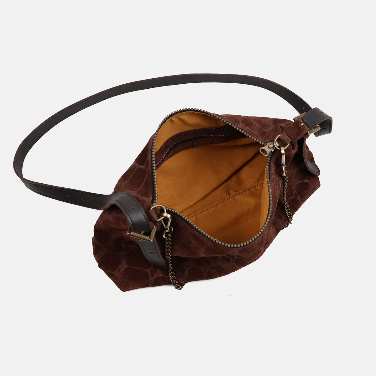 Bolso de hombro y bandolera Coco de serraje en color testa, interior abierto mostrando el forro
