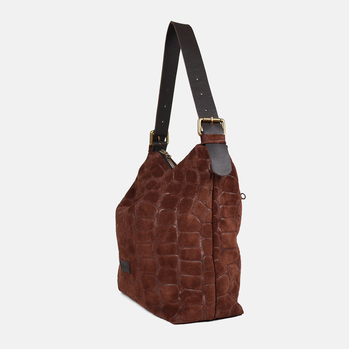Bolso de hombro Coco de serraje en color testa, vista de tres cuartos con asa de piel